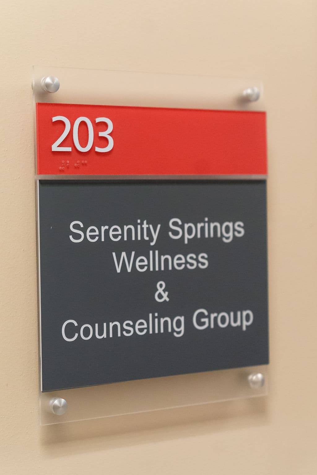 Serenity Springs Wellness & Counseling Group office sign for Suite 203.